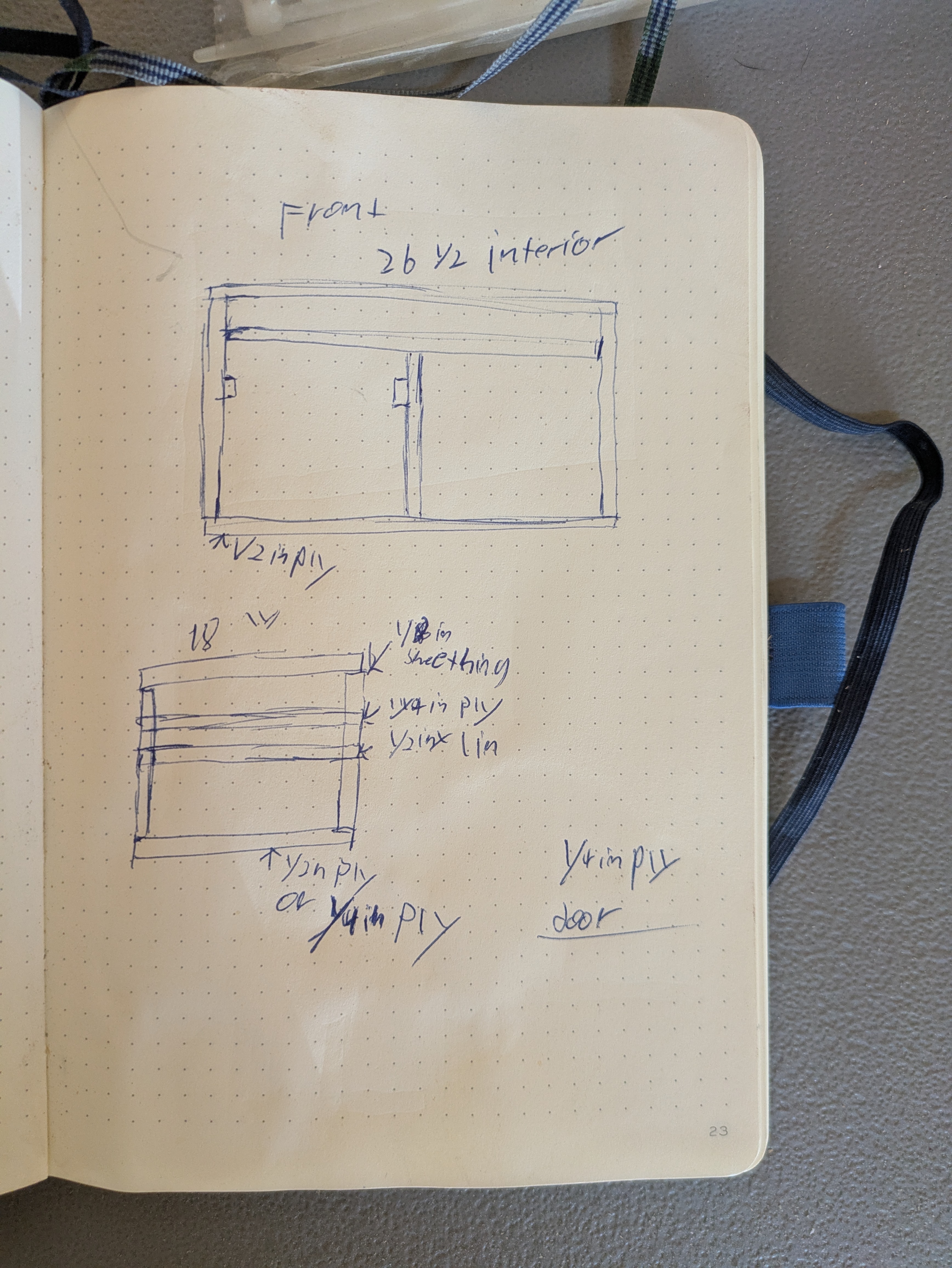 Front and side drawings of the chuck box plans in a dot grid notebook.